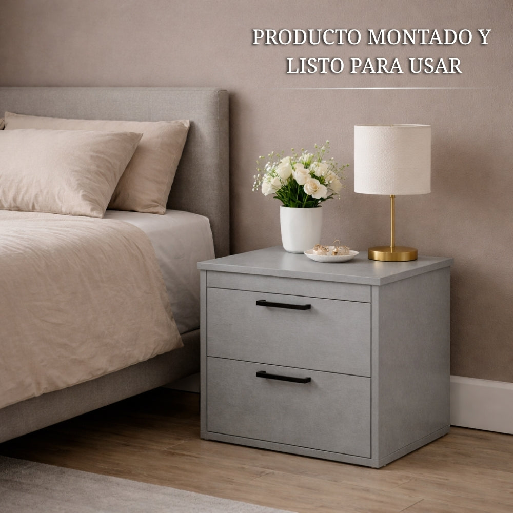 mesita de noche gris con compartimento secreto instalada y lista para usar junto a la cama con diseño moderno y discreto